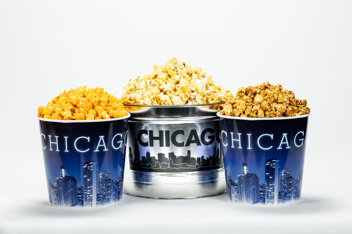 Three containers of popcorn with 'Chicago' branding on a white background